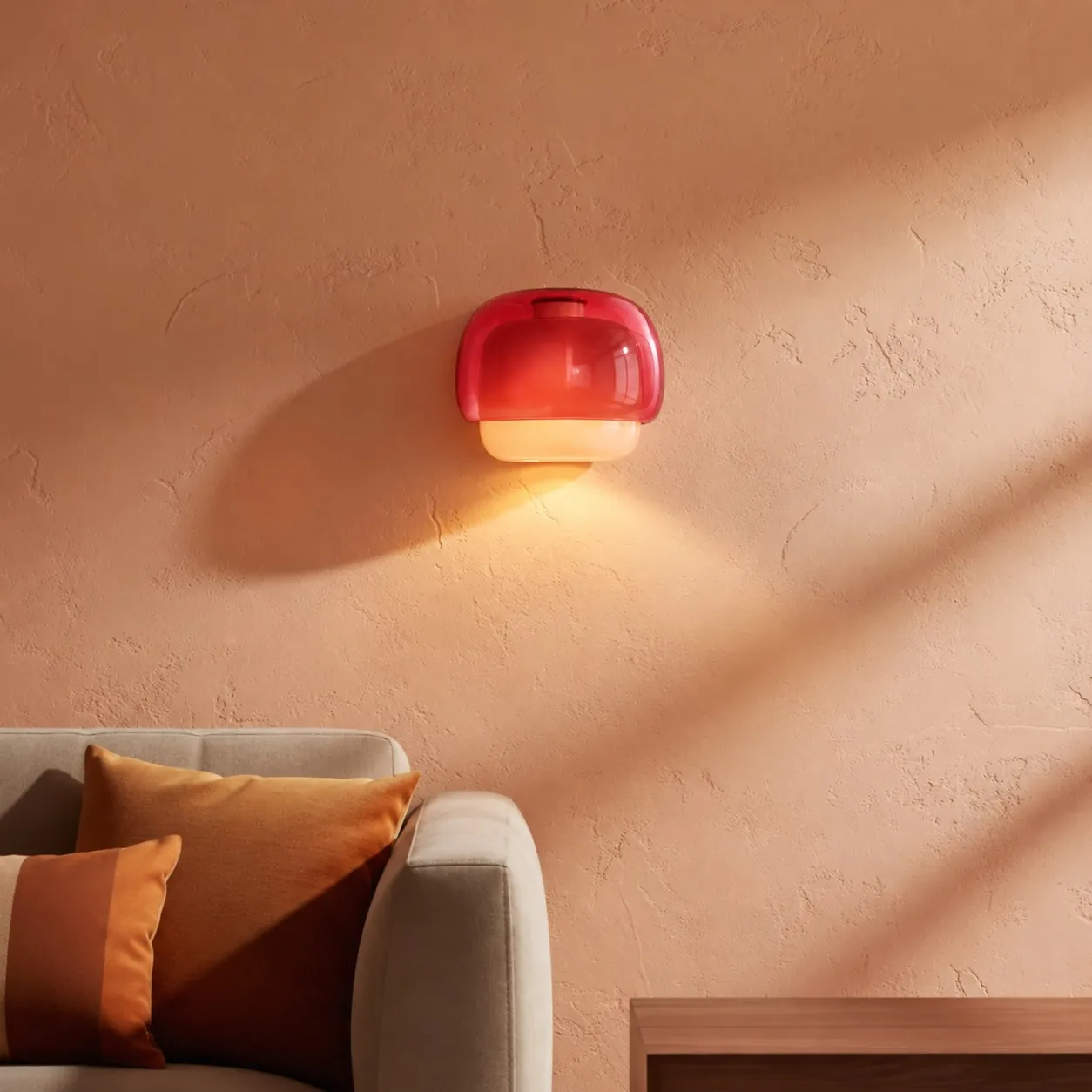 Burgundy sconce on a peach living-room wall