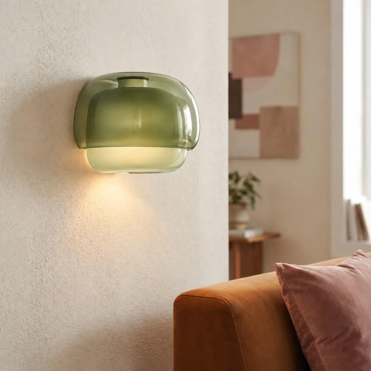 Green sconce beside a sofa