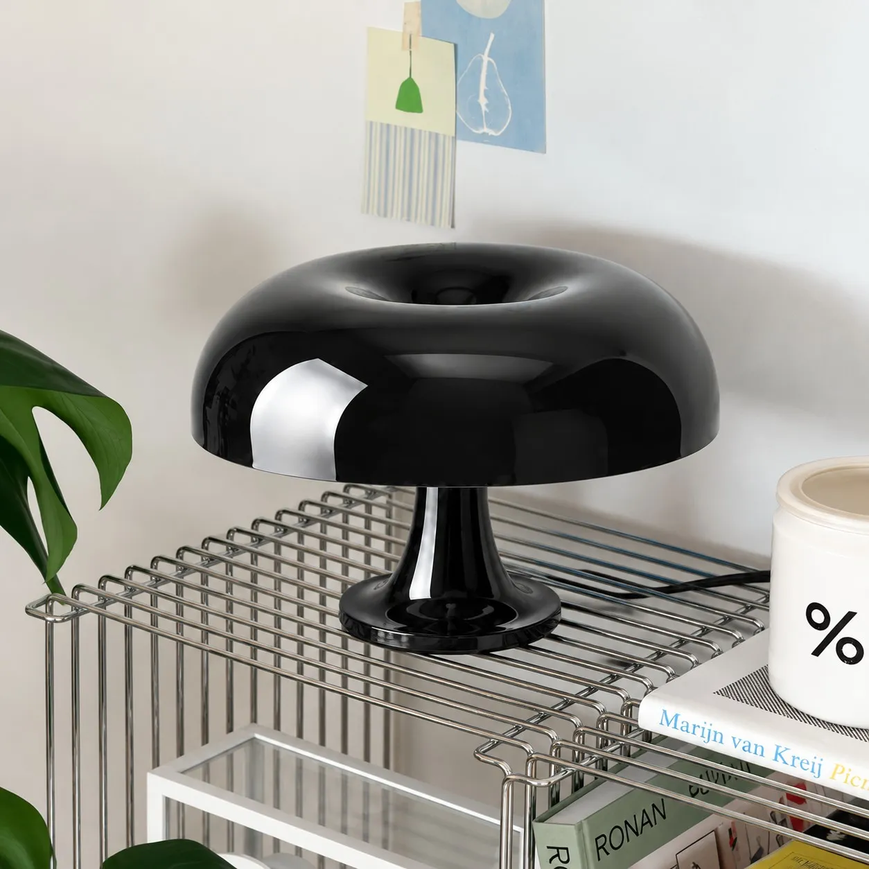 Black lamp on a wire shelf