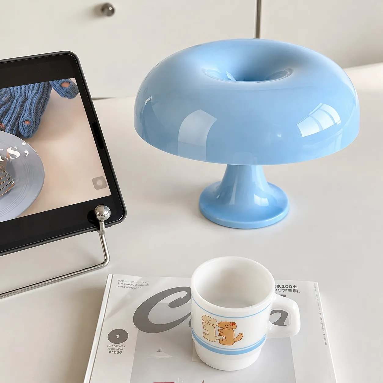 Light blue lamp on a desk