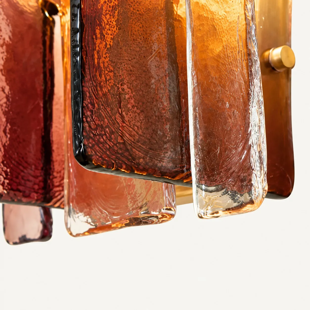 Gold pin holding a glass plate