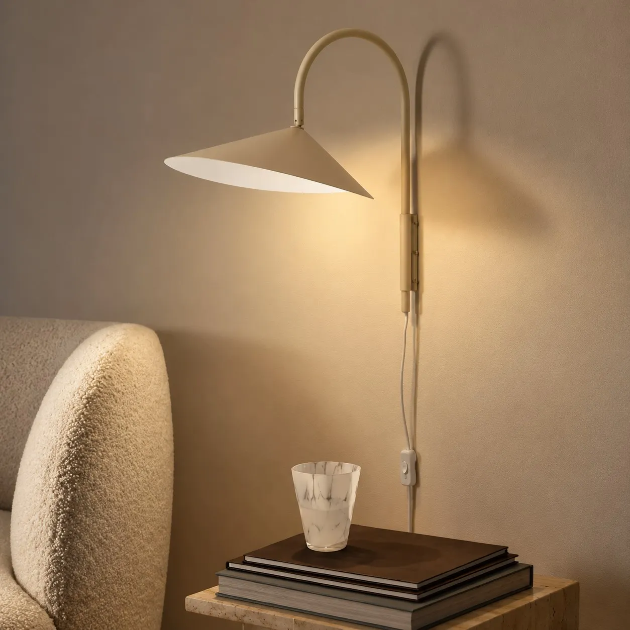 Cashmere swivel wall lamp beside a chair