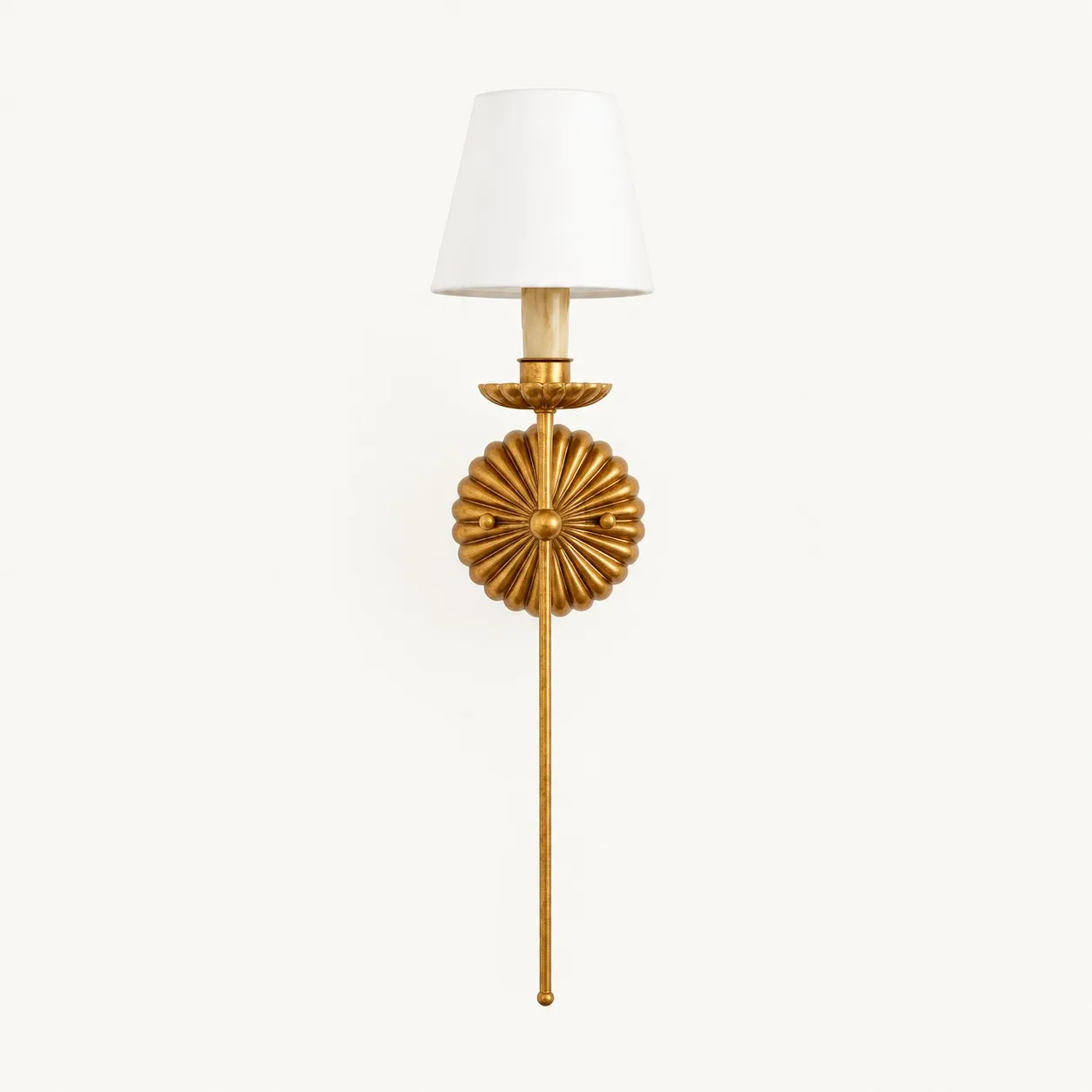 Single antique gold wall lamp with a white fabric shade