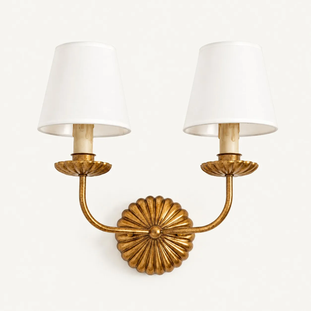 Double antique gold wall lamp with two white fabric shades