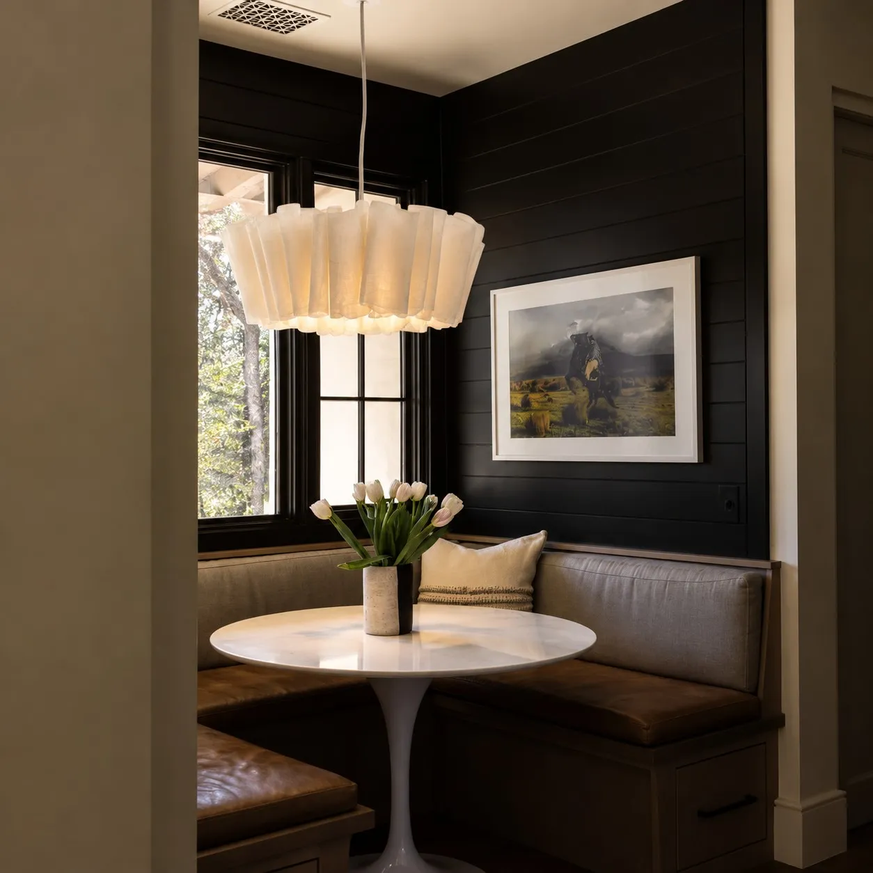Pleated linen pendant over a breakfast nook