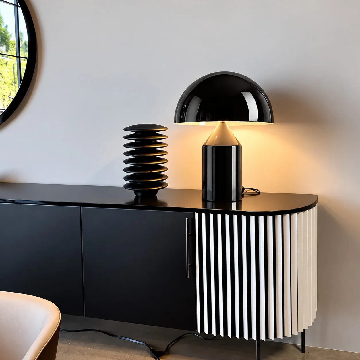 Glossy black mushroom table lamp on a sideboard