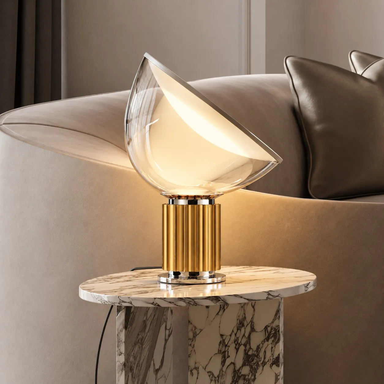 Brass glass bowl lamp on a marble table beside a sofa