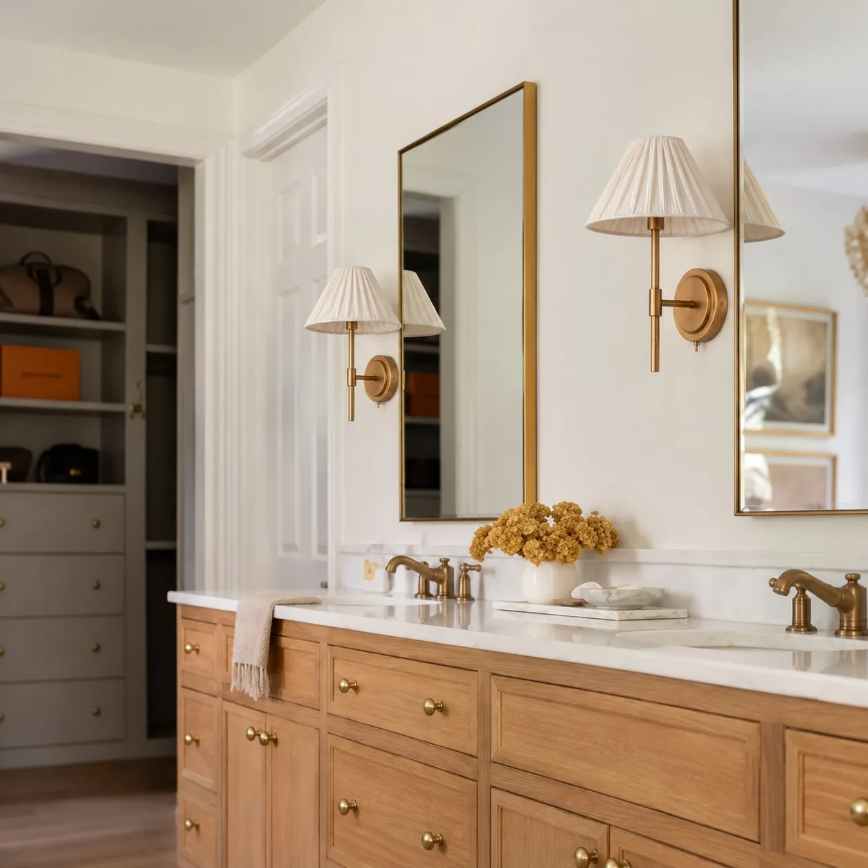 Two pleated linen wall lights in a bathroom