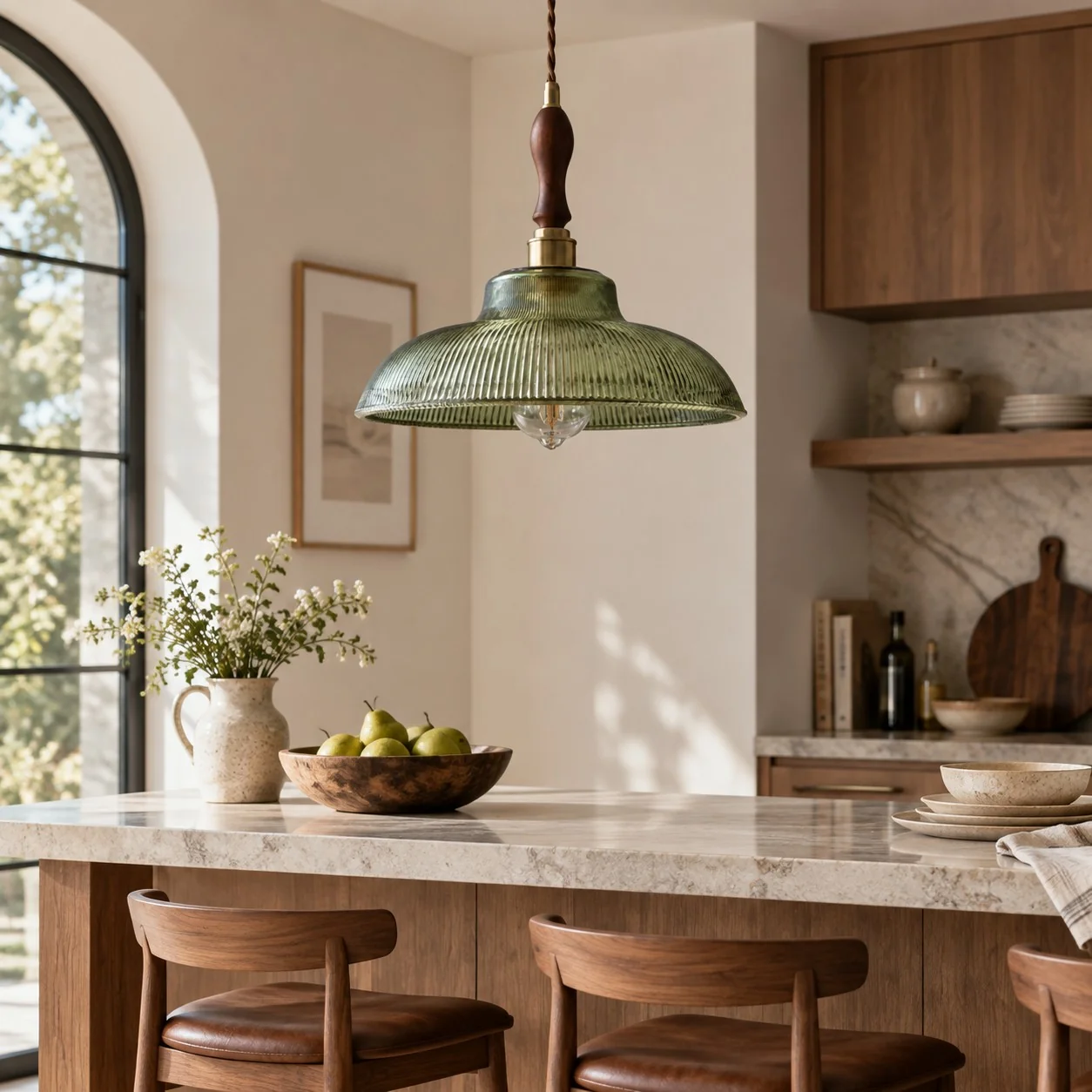 Green glass pendant over a kitchen island