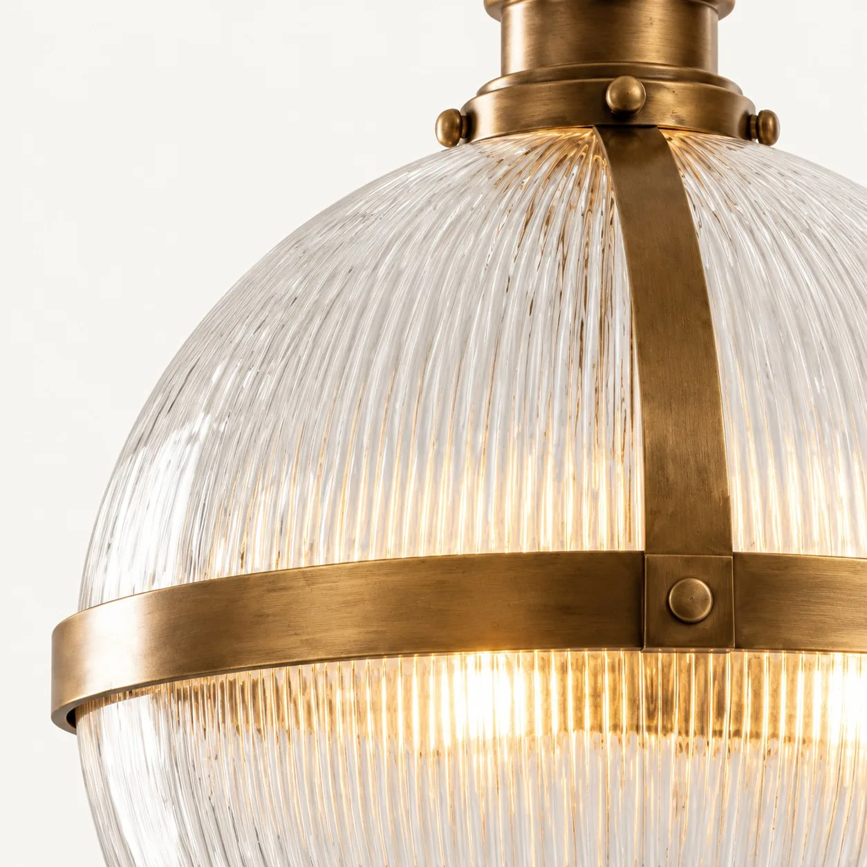 Close-up of Rivora ribbed glass and brass mid-band