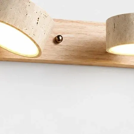 Brass pivot between two travertine shades