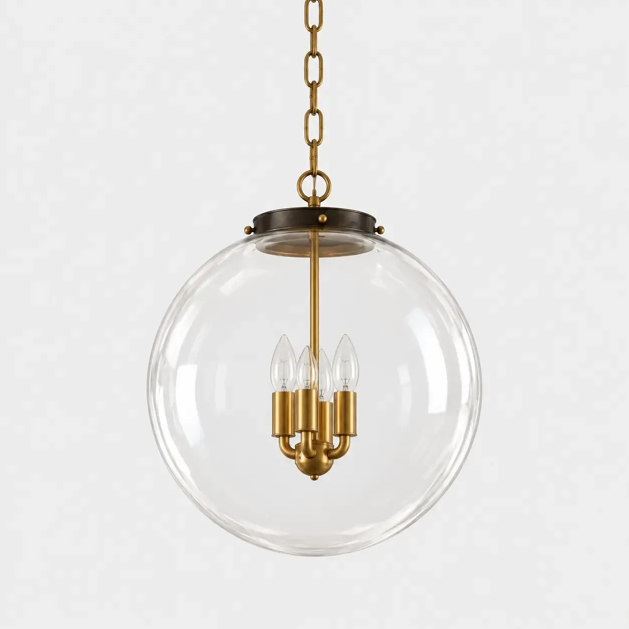 Smaller clear glass globe pendant, 14 inches across, with a brass chain and four candle bulbs