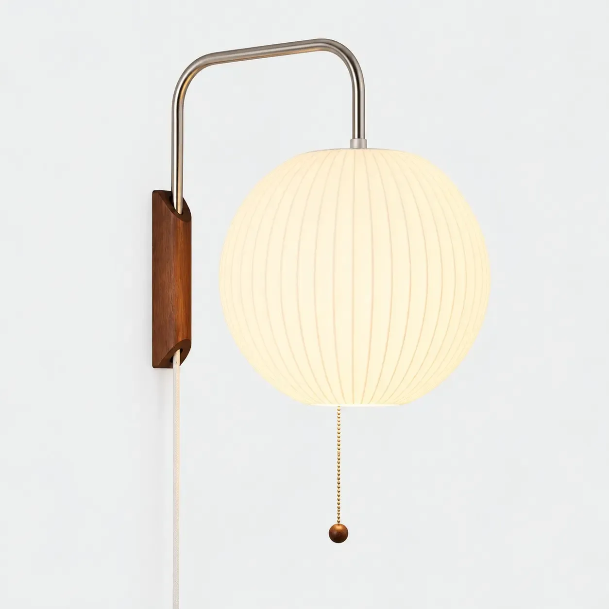 Sphere ribbed wall sconce on a light background, shade lit