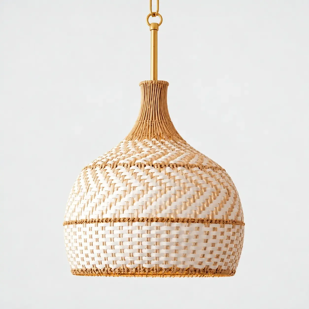 Two-tone rattan dome pendant on a light background with a warm gold-tone rod and chain