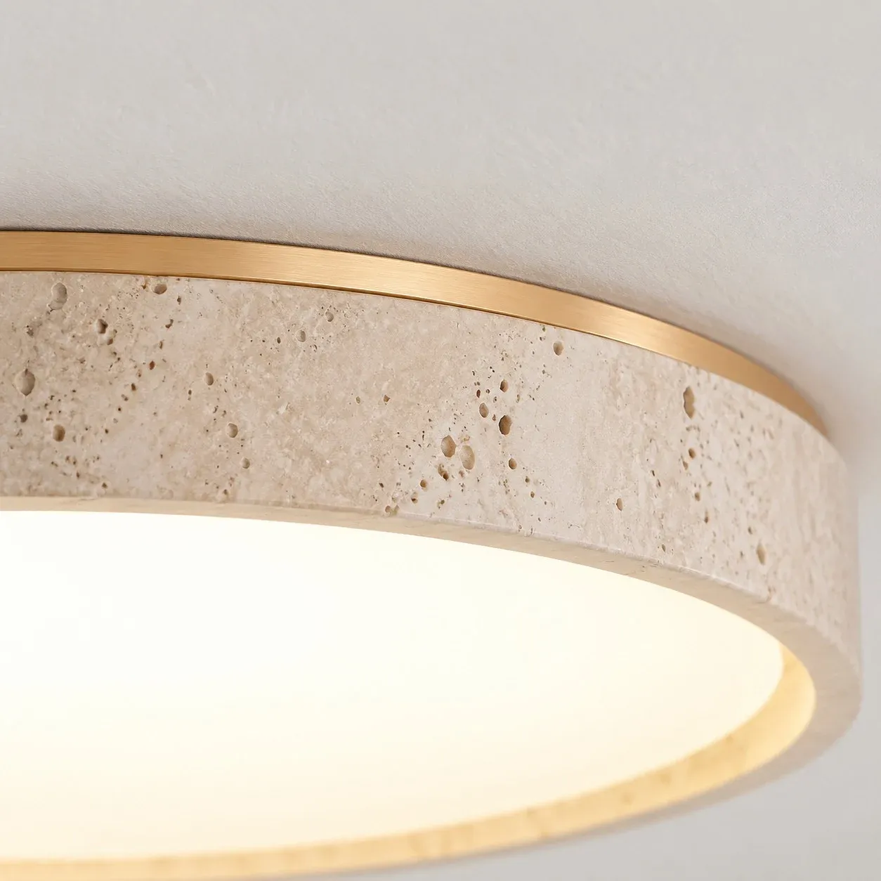 Wood-color band above a yellow travertine ring and a lit diffuser