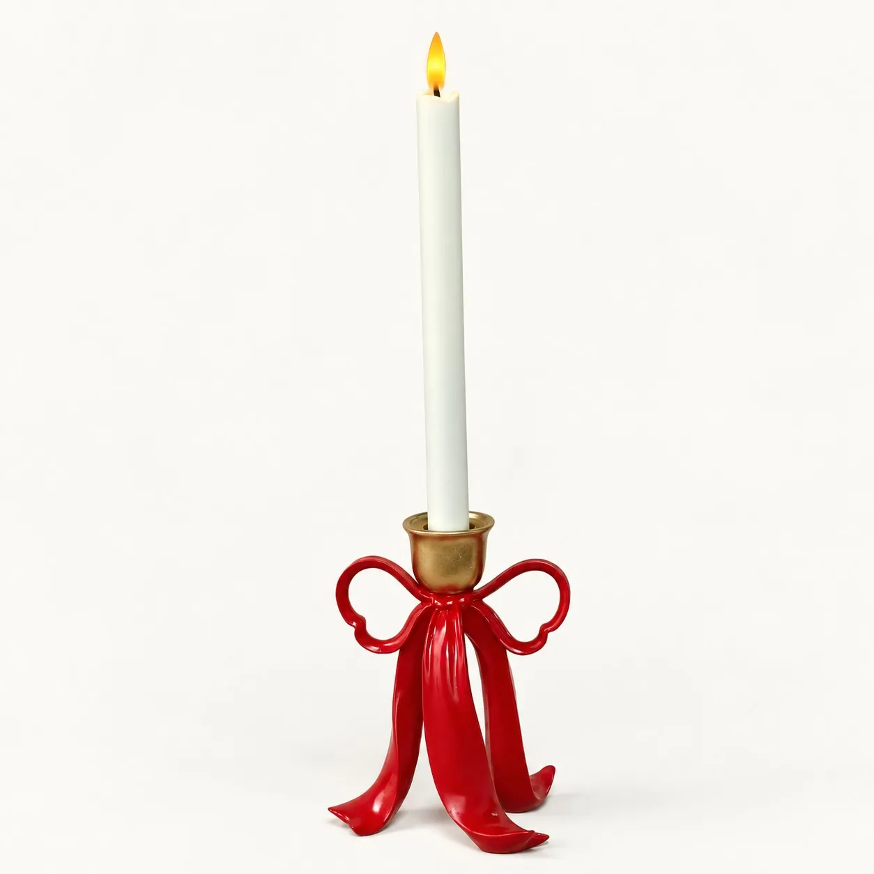 Red resin ribbon bow candle holder showing the center socket