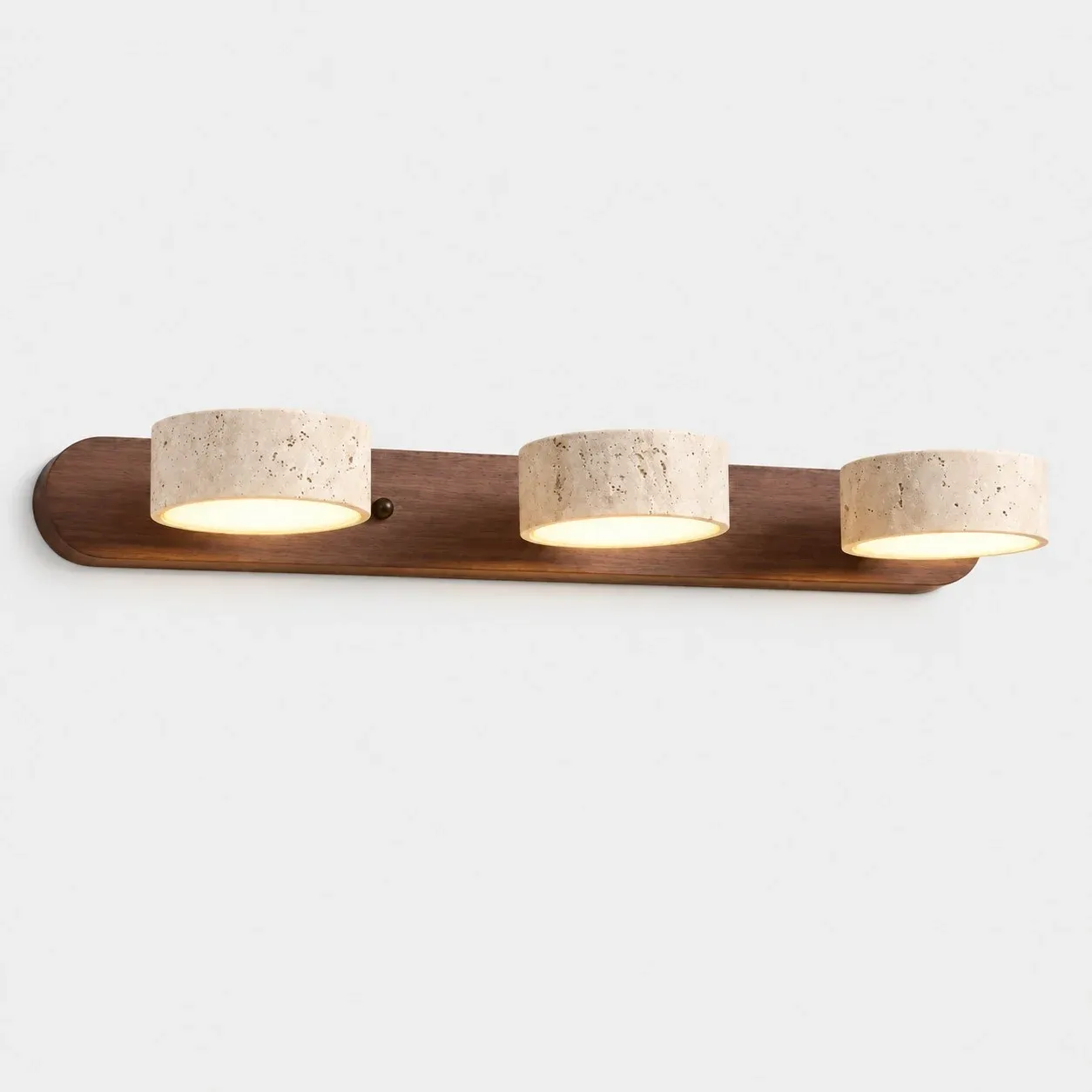 Three travertine shades on a walnut bar