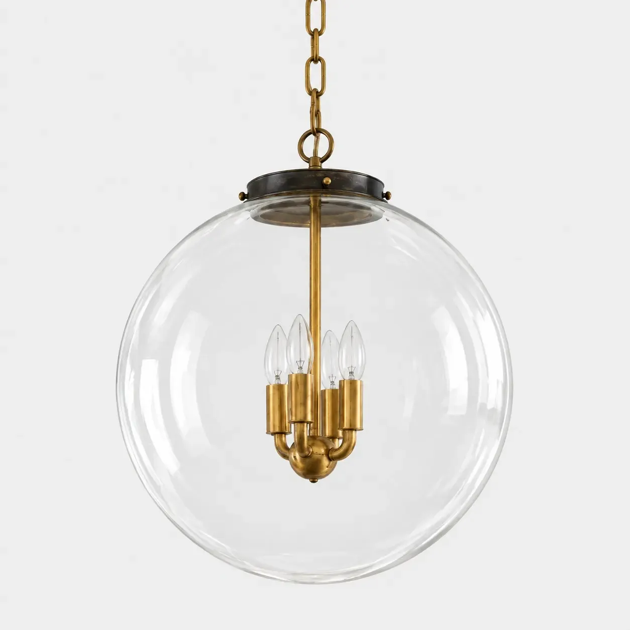 Larger clear glass globe pendant, 18 inches across, with a brass chain and four candle bulbs