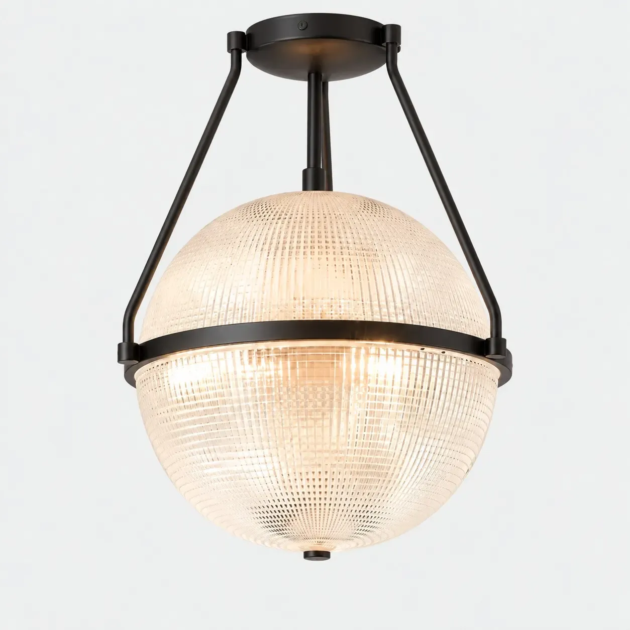 Black glass globe semi-flush ceiling light on a light background, with bulbs fitted
