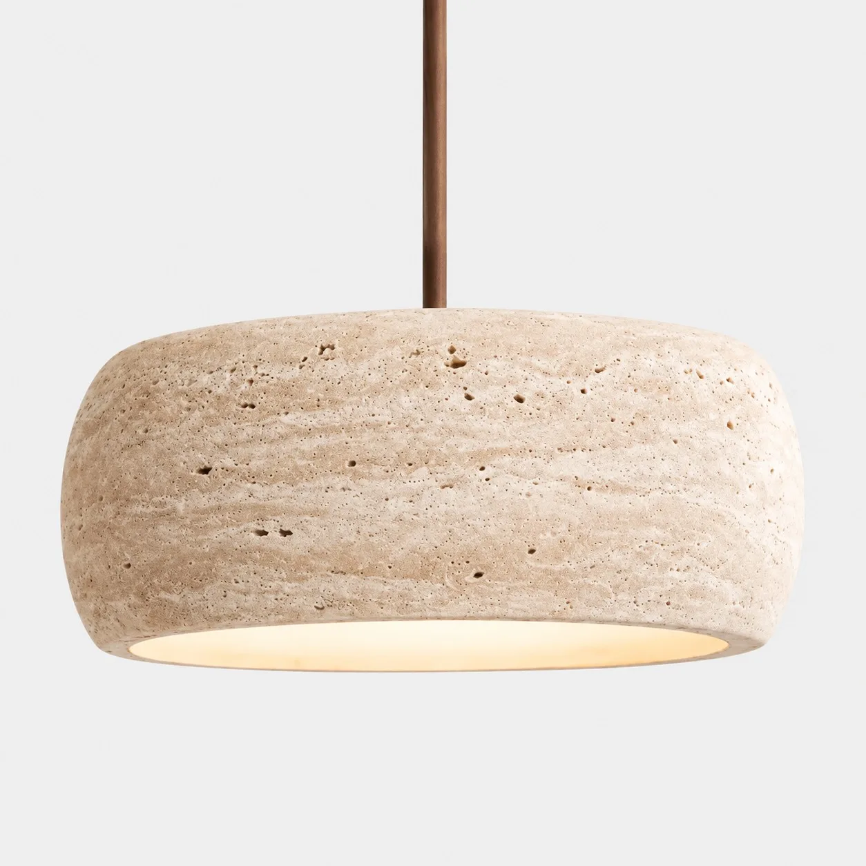 Close view of a large rounded travertine shade