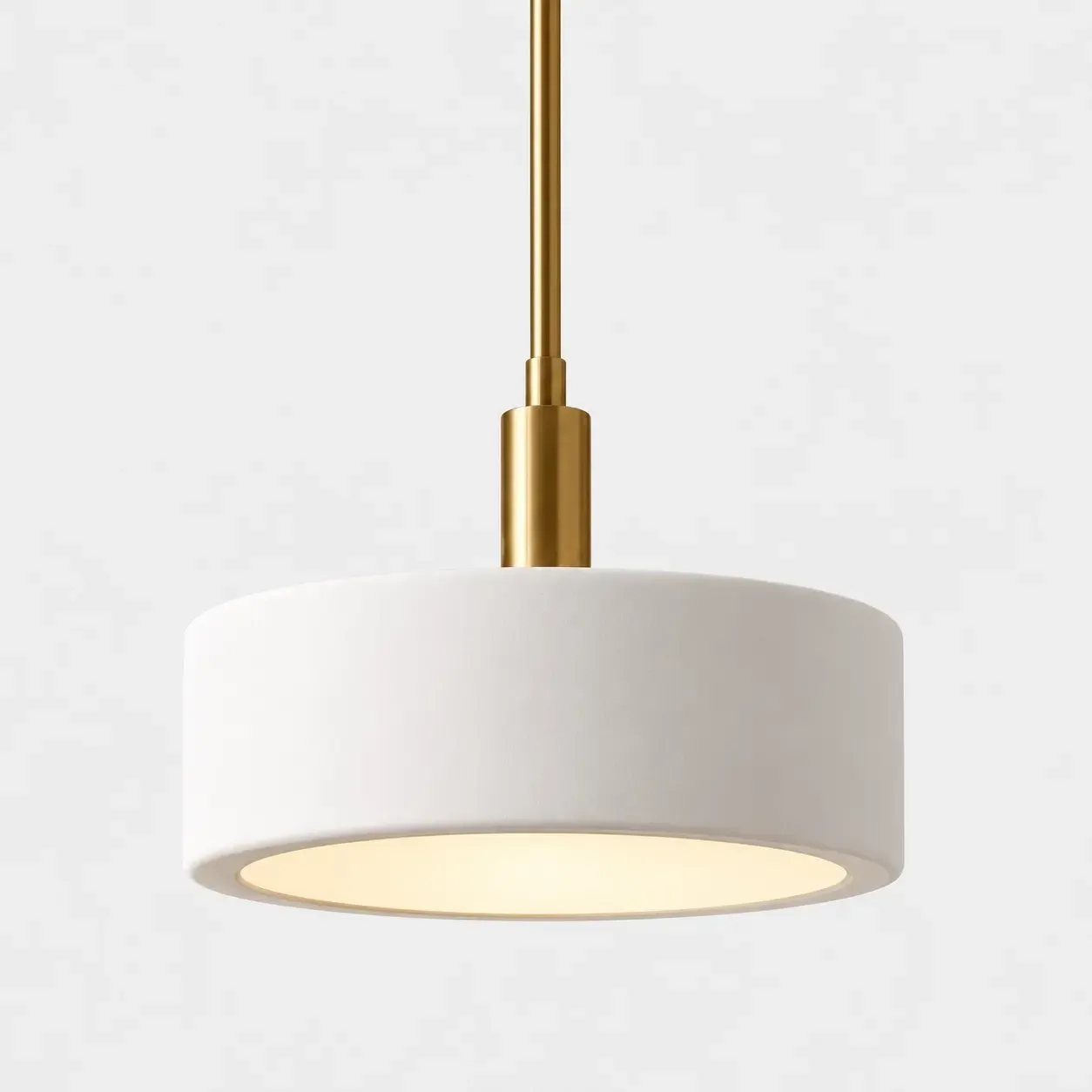 14 inch white porcelain drum pendant with a metal rod, light glowing from the open bottom