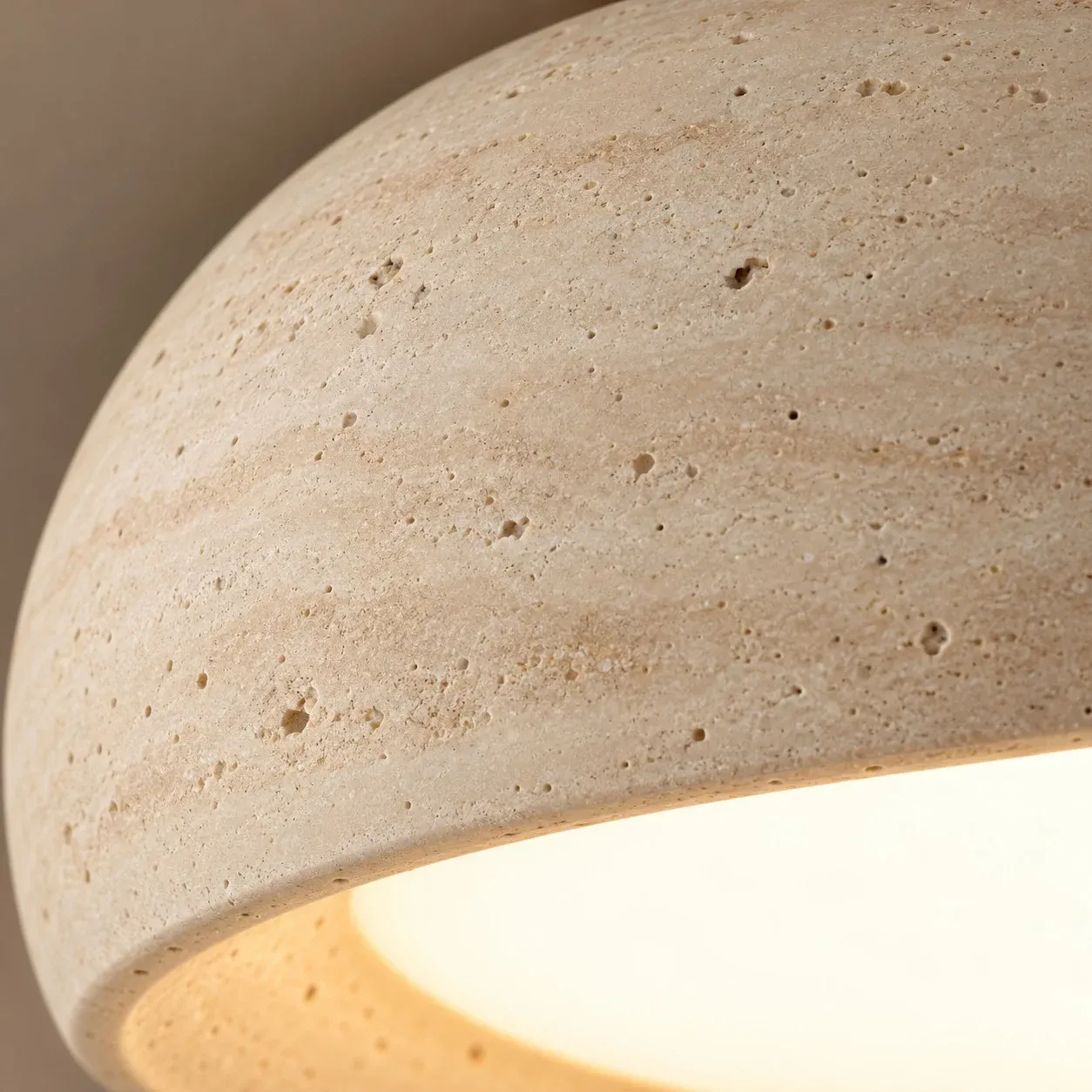 Travertine pores along the bowl edge