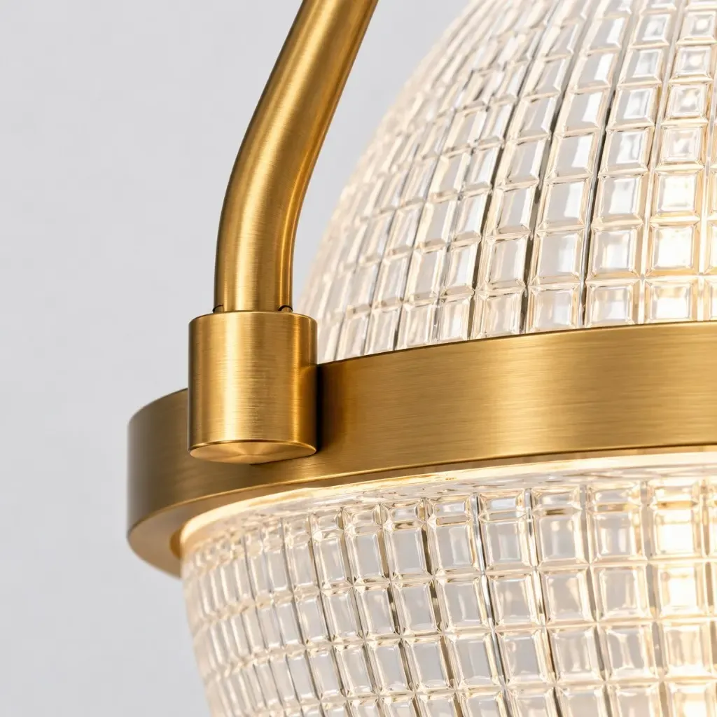 Brushed gold arm collar meeting the metal band on hammered clear glass