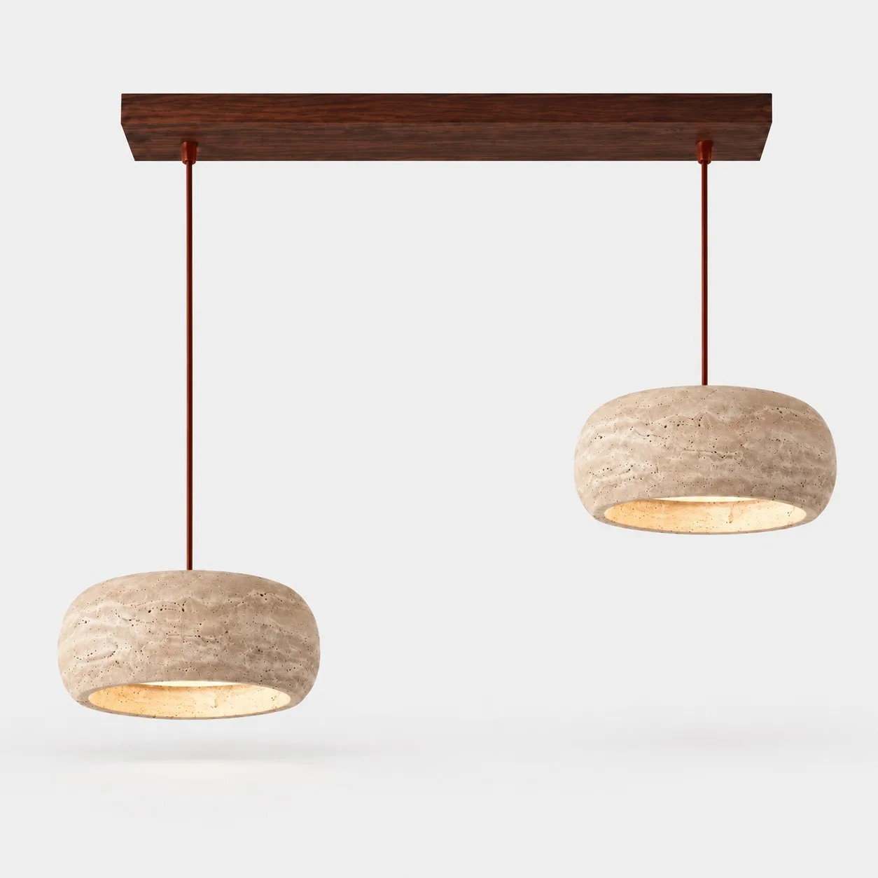 Two rounded travertine pendants on a walnut bar
