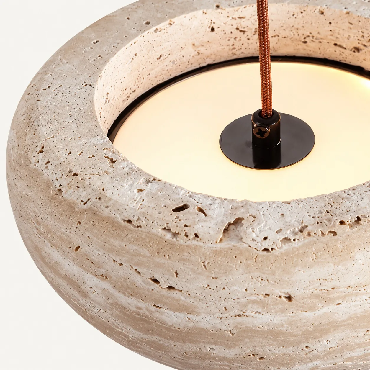 Top view into the travertine drum with braided cord fitting
