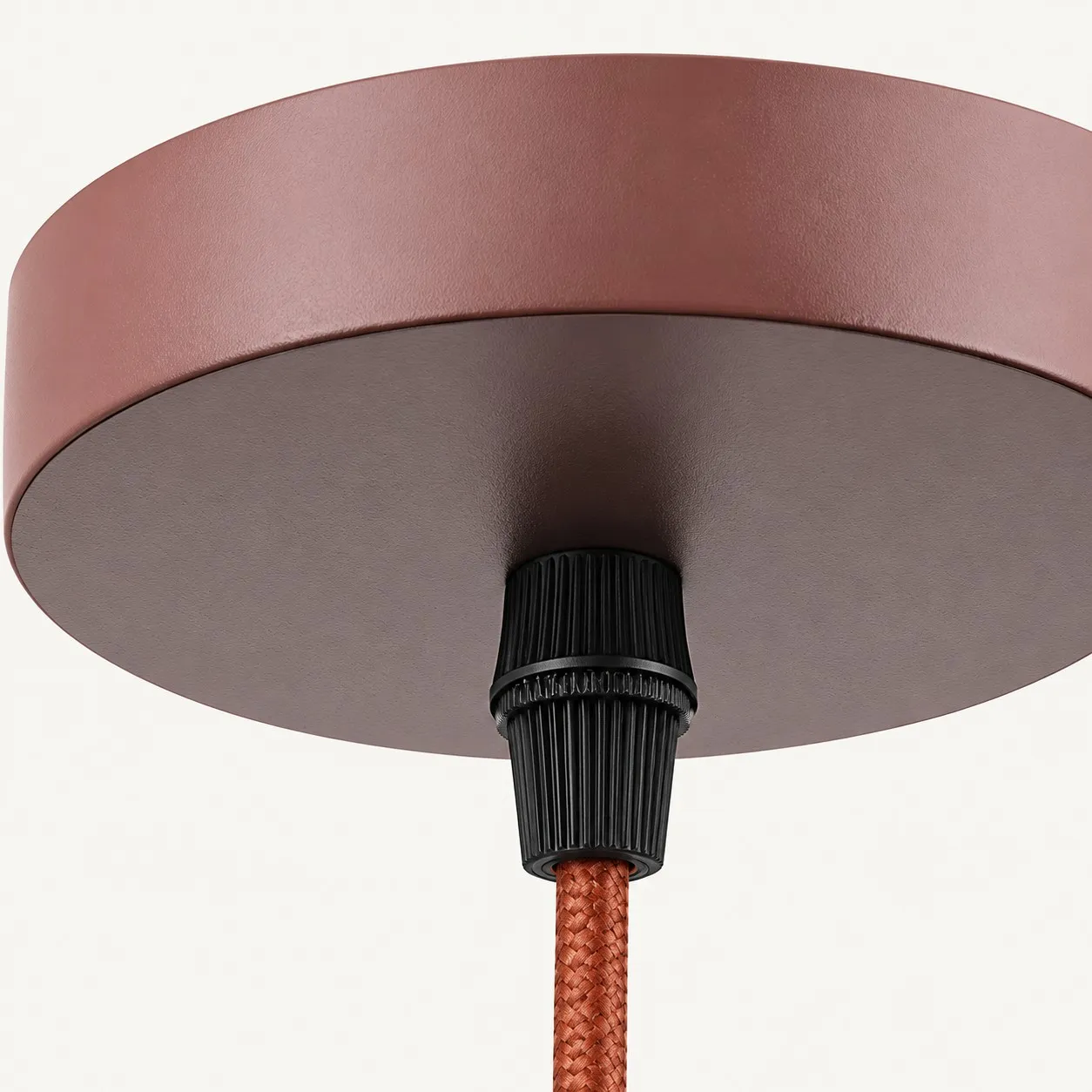 Travertine disc pendant over a kitchen sink