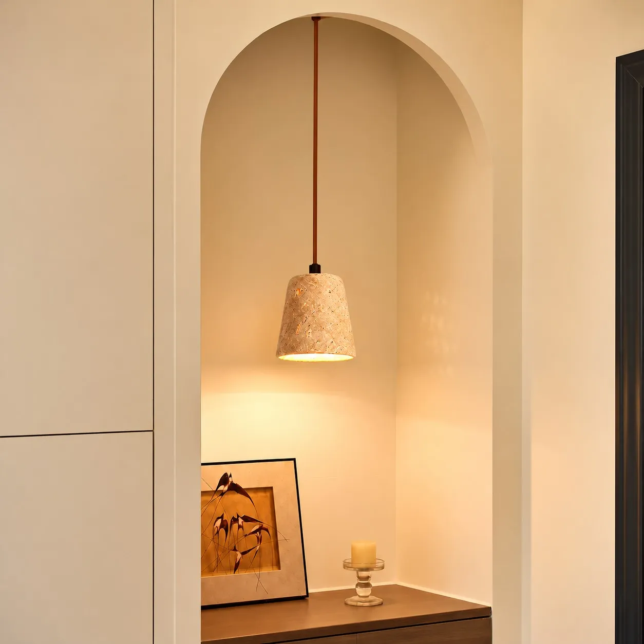 Travertine bowl pendant beside a bed