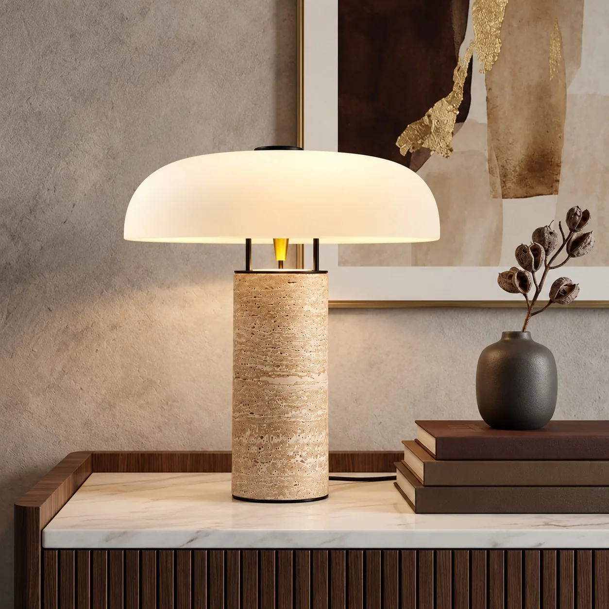 Travertine dome table lamp on a marble-top console